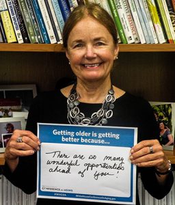 Marci Kerz with sign "there are so many wonderful opportunities ahead of you"