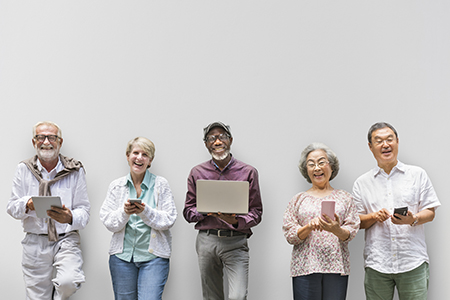 Diverse group of Seniors using devices for online classes