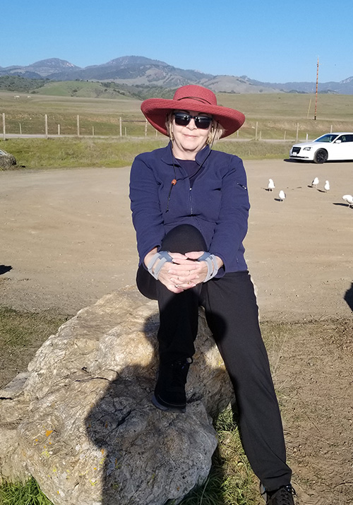 Linda with mountains in the background