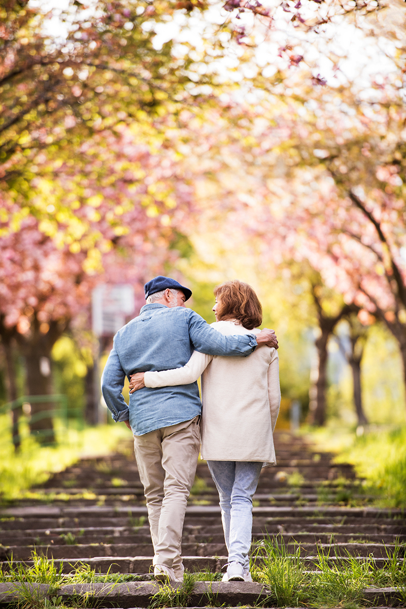 Beautiful senior couple in love outside in spring nature.